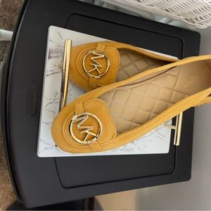 Like new Michael Kors yellow flat shoes, size 6 1/2, smoke free home.